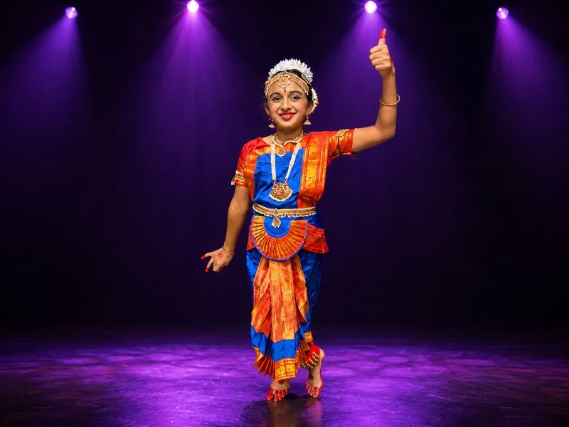 Bharatanatyam student stepping into the spotlight at a Spotlight Academy stage performance, The Woodlands TX