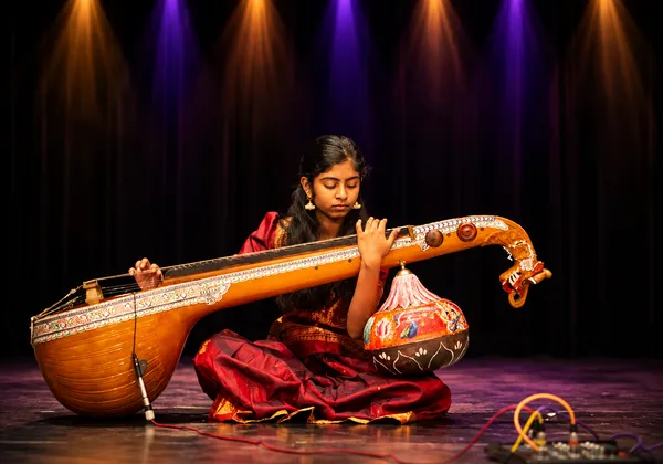 Veena students performing at Spotlight Academy community event